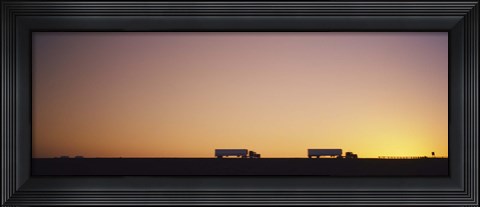 Framed Silhouette of two trucks moving on a highway, Interstate 5, California, USA Print