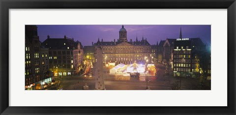 Framed High angle view of a town square lit up at dusk, Dam Square, Amsterdam, Netherlands Print