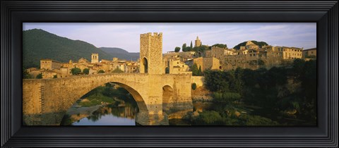 Framed Arch bridge across a river in front of a city, Besalu, Catalonia, Spain Print