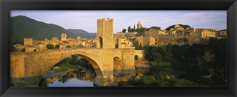 Framed Arch bridge across a river in front of a city, Besalu, Catalonia, Spain Print