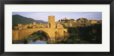 Framed Arch bridge across a river in front of a city, Besalu, Catalonia, Spain Print