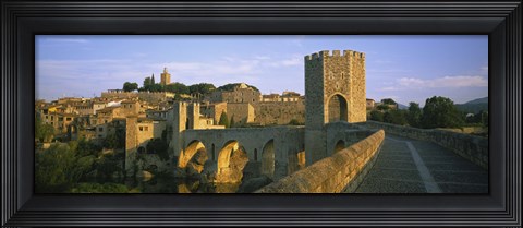 Framed Footbridge across a river in front of a city, Besalu, Catalonia, Spain Print