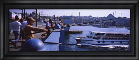 Framed Side profile of fishermen fishing in a river, Galata Bridge, Istanbul, Turkey Print
