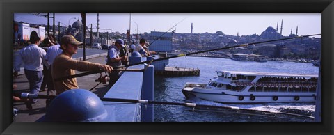 Framed Side profile of fishermen fishing in a river, Galata Bridge, Istanbul, Turkey Print