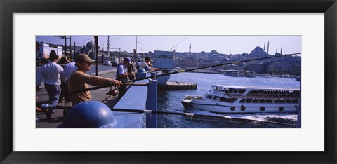 Framed Side profile of fishermen fishing in a river, Galata Bridge, Istanbul, Turkey Print