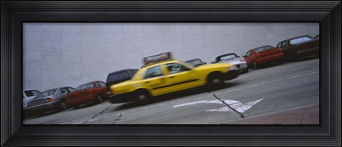 Framed Taxi running on the road, San Francisco, California, USA Print