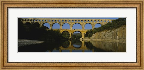 Framed Reflection of an arch bridge in a river, Pont Du Gard, France Print