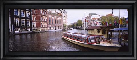 Framed Tourboat in a channel, Amsterdam, Netherlands Print