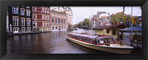 Framed Tourboat in a channel, Amsterdam, Netherlands Print