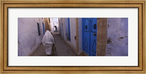 Framed Rear view of a woman walking on the street, Medina, Kairwan, Tunisia Print