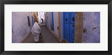 Framed Rear view of a woman walking on the street, Medina, Kairwan, Tunisia Print