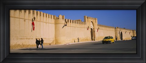 Framed Car on a road in front of a fortified wall, Medina, Kairwan, Tunisia Print