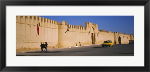 Framed Car on a road in front of a fortified wall, Medina, Kairwan, Tunisia Print