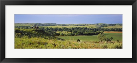 Framed Three mountain bikers on a hill, Kansas, USA Print