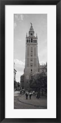 Framed Group of people walking near a church, La Giralda, Seville Cathedral, Seville, Seville Province, Andalusia, Spain Print