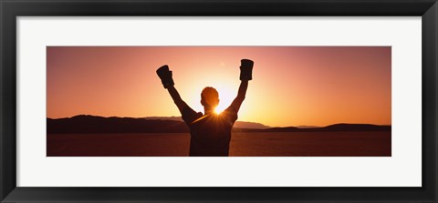 Framed Silhouette of a person wearing boxing gloves in a desert at dusk, Black Rock Desert, Nevada, USA Print