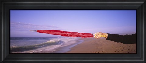 Framed Close-up of a woman's hand pointing with a red umbrella, Point Reyes National Seashore, California, USA Print