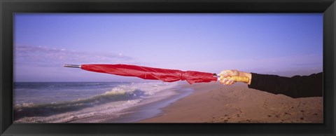 Framed Close-up of a woman&#39;s hand pointing with a red umbrella, Point Reyes National Seashore, California, USA Print