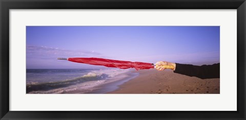 Framed Close-up of a woman&#39;s hand pointing with a red umbrella, Point Reyes National Seashore, California, USA Print