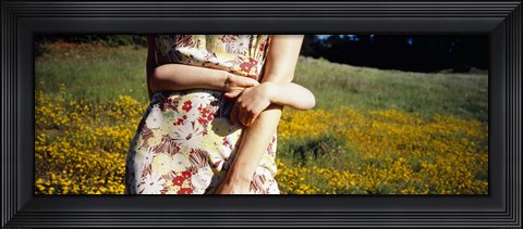 Framed Mid section view of a girl hugging her mother in a field, Marin County, California, USA Print