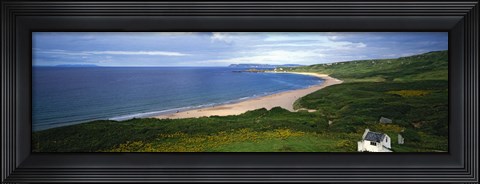 Framed Birds-eye view of sea, white stone cottage, Northern Ireland. Print