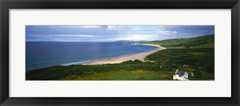 Framed Birds-eye view of sea, white stone cottage, Northern Ireland. Print