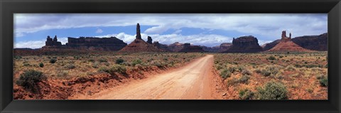 Framed Dirt road through desert landscape with sandstone formations, Utah. Print