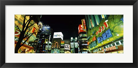 Framed Low angle view of buildings lit up at night, Shinjuku Ward, Tokyo Prefecture, Kanto Region, Japan Print