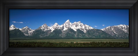 Framed Trees in a forest with mountains in the background, Teton Point Turnout, Teton Range, Grand Teton National Park, Wyoming, USA Print