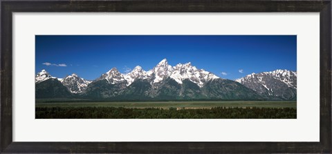 Framed Trees in a forest with mountains in the background, Teton Point Turnout, Teton Range, Grand Teton National Park, Wyoming, USA Print