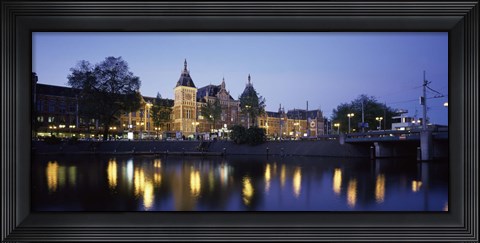 Framed Reflection of a railway station in water, Amsterdam Central Station, Amsterdam, Netherlands Print