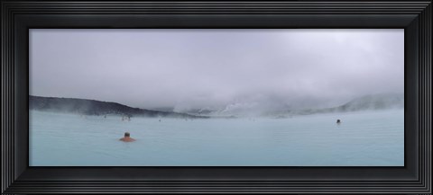 Framed Tourist swimming in a thermal pool, Blue Lagoon, Reykjanes Peninsula, Reykjavik, Iceland Print
