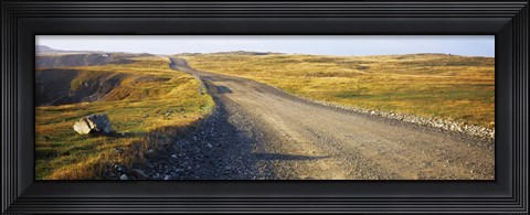 Framed Gravel road passing through a landscape, Cape Bonavista, Newfoundland, Newfoundland and Labrador, Canada Print