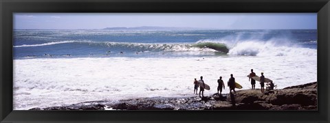 Framed Silhouette of surfers standing on the beach, Australia Print