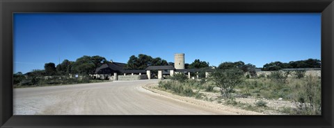 Framed Road leading towards the entrance of a rest camp, Okaukuejo, Etosha National Park, Kunene Region, Namibia Print