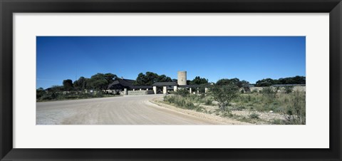 Framed Road leading towards the entrance of a rest camp, Okaukuejo, Etosha National Park, Kunene Region, Namibia Print