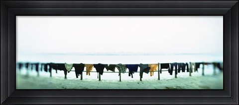 Framed Clothes drying at the riverbank, Ganges River, Varanasi, Uttar Pradesh, India Print