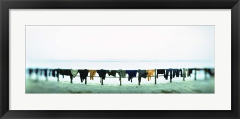 Framed Clothes drying at the riverbank, Ganges River, Varanasi, Uttar Pradesh, India Print