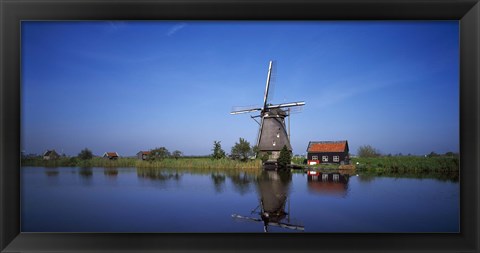 Framed Reflection of a traditional windmill in a lake, Netherlands Print