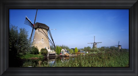 Framed Traditional windmills in a field, Netherlands Print