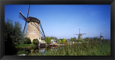 Framed Traditional windmills in a field, Netherlands Print