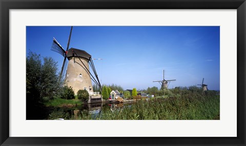 Framed Traditional windmills in a field, Netherlands Print