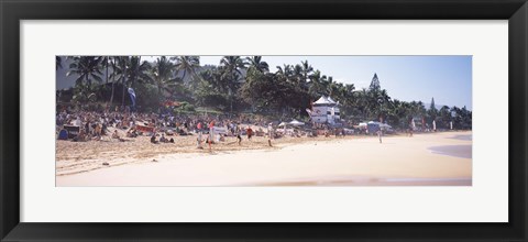 Framed Tourists on the beach, North Shore, Oahu, Hawaii, USA Print