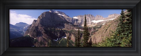 Framed Trees with a mountain range in the background, US Glacier National Park, Montana, USA Print