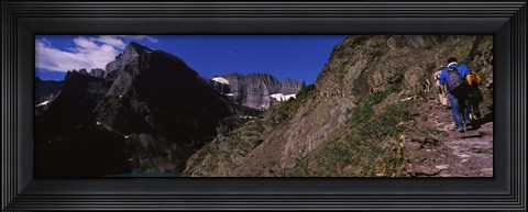 Framed Hikers hiking on a mountain, US Glacier National Park, Montana, USA Print