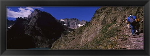Framed Hikers hiking on a mountain, US Glacier National Park, Montana, USA Print