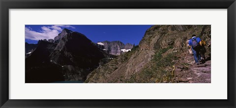 Framed Hikers hiking on a mountain, US Glacier National Park, Montana, USA Print