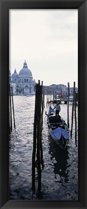 Framed Gondolier in a gondola with a cathedral in the background, Santa Maria Della Salute, Venice, Veneto, Italy Print