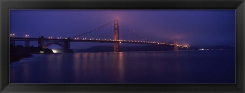 Framed Suspension bridge lit up at dawn viewed from fishing pier, Golden Gate Bridge, San Francisco Bay, San Francisco, California, USA Print