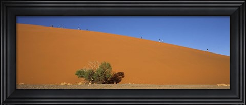Framed Tourists climbing up a sand dune, Dune 45, Sossusvlei, Namib Desert, Namibia Print